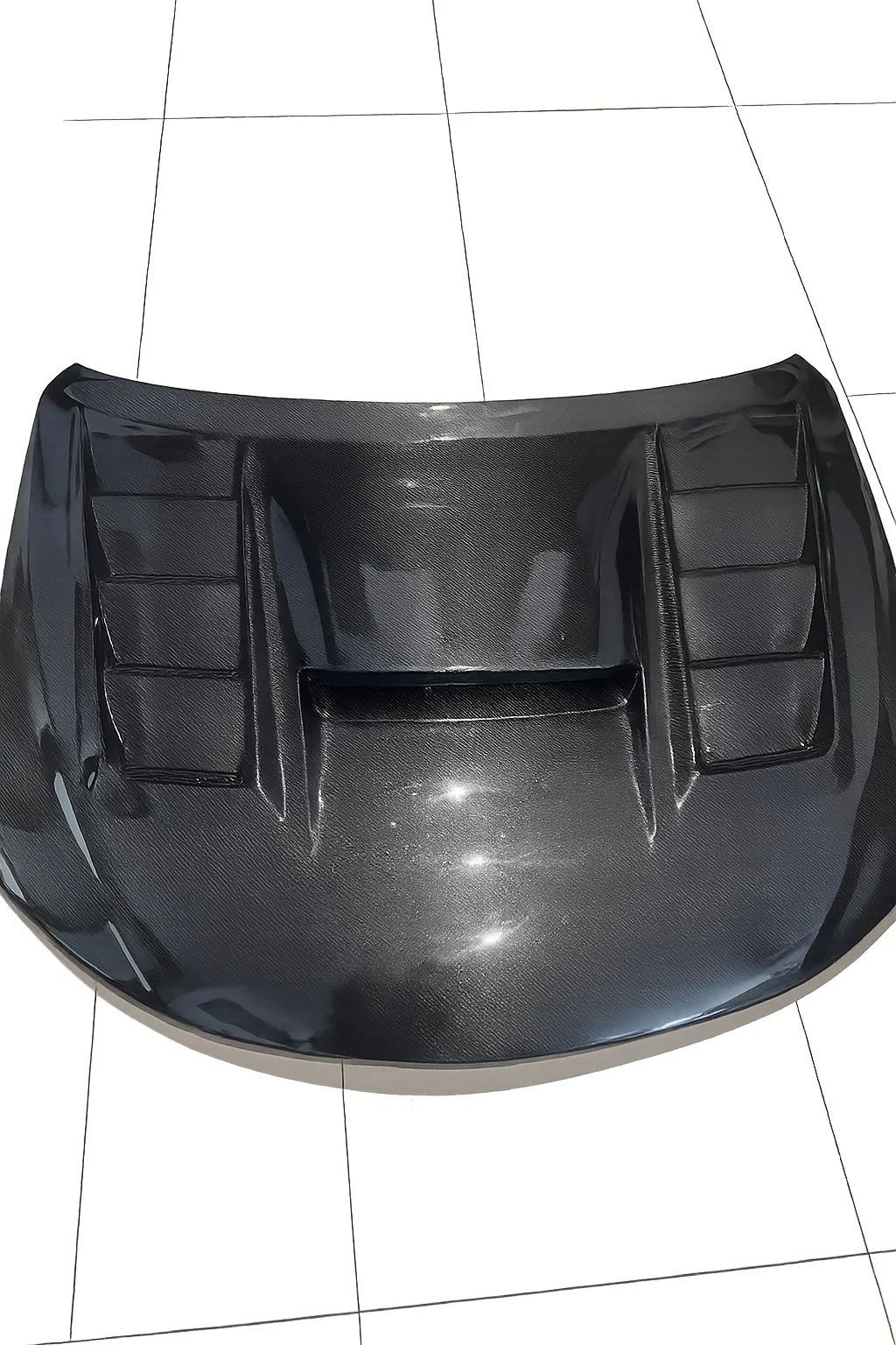 Photographed carbon part representative of Subaru Carbon Bonnet
