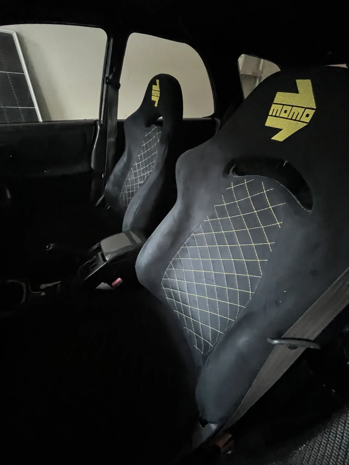 Actual Subaru MOMO seat upholstery with yellow stitching