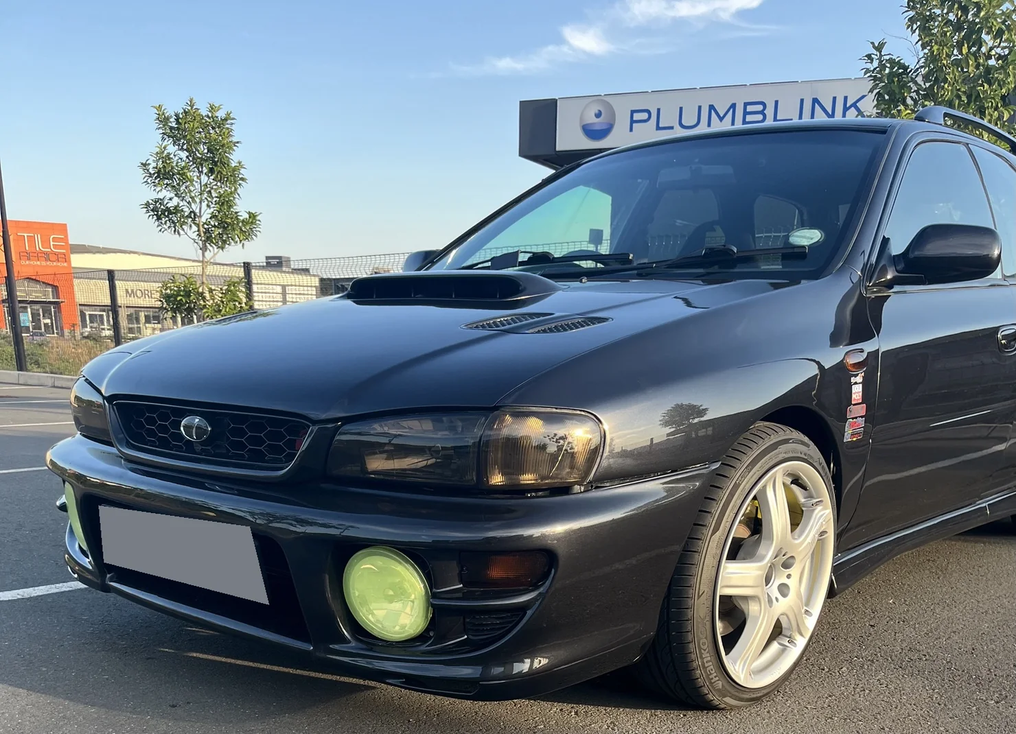 Actual black 2000 Subaru GF with obscured registration plate