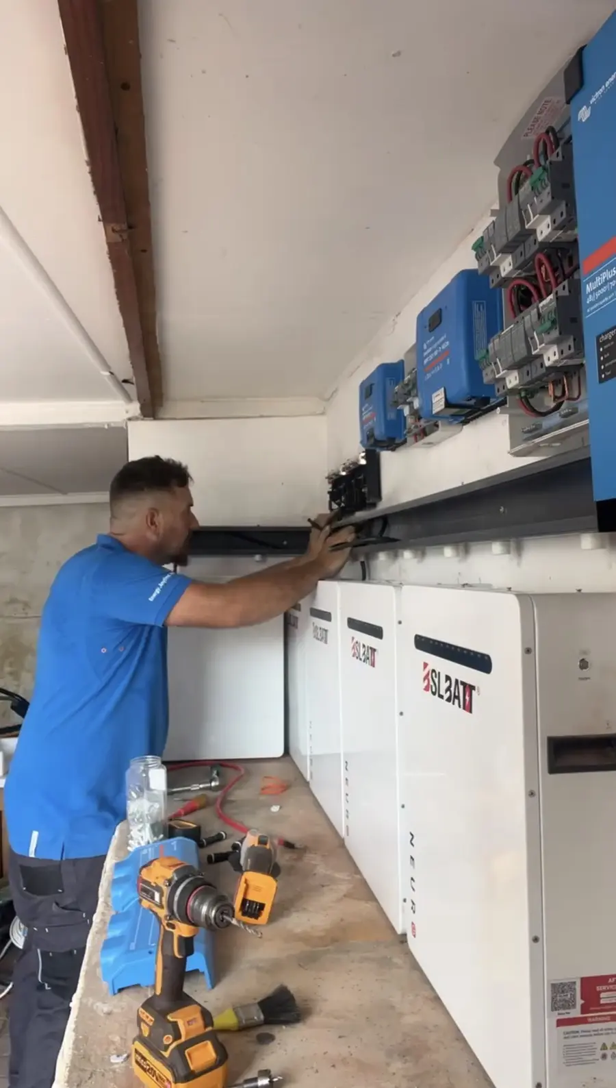 MicroSec technician commissioning a solar and battery storage system in Virginia, Durban North.